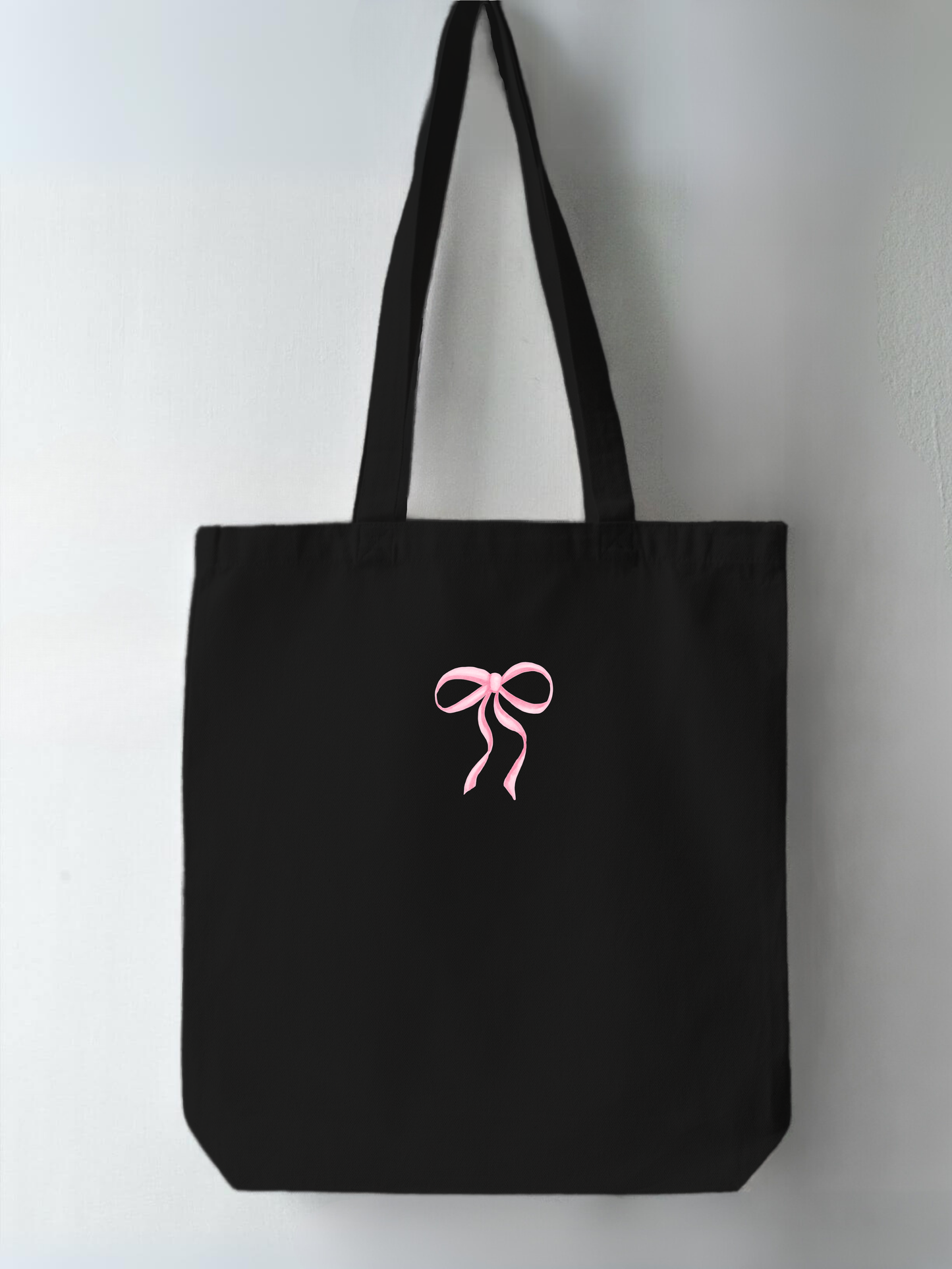 This is Bow design coquette Trendy, high-quality tote bag for Indian women. Aesthetic fashion item from Heart Utopia, perfect for casual outings and everyday use. Buy now to elevate your style with this Pinterest-inspired, durable, spacious tote. Best tote bag online in India, available for fast shipping